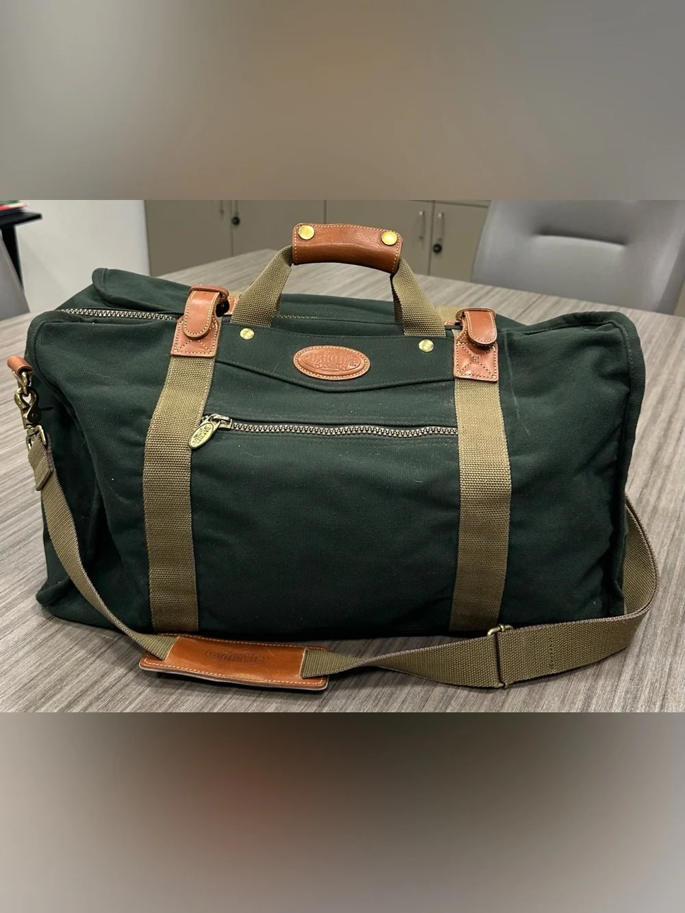 Tumi Dakota Dark Green Canvas Duffel with Tan Straps and Brown Leather Trim